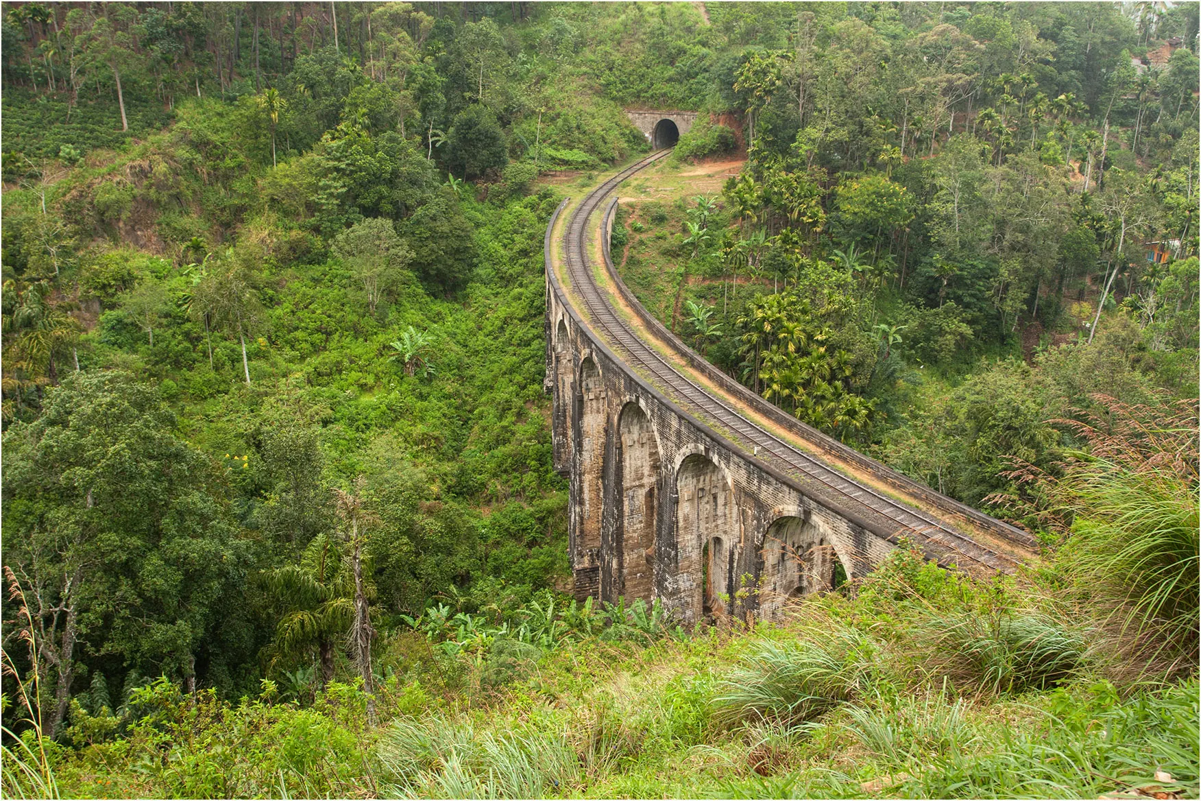 The Nine Arch Bridge crossing the green highlands of Ella, Sri Lanka